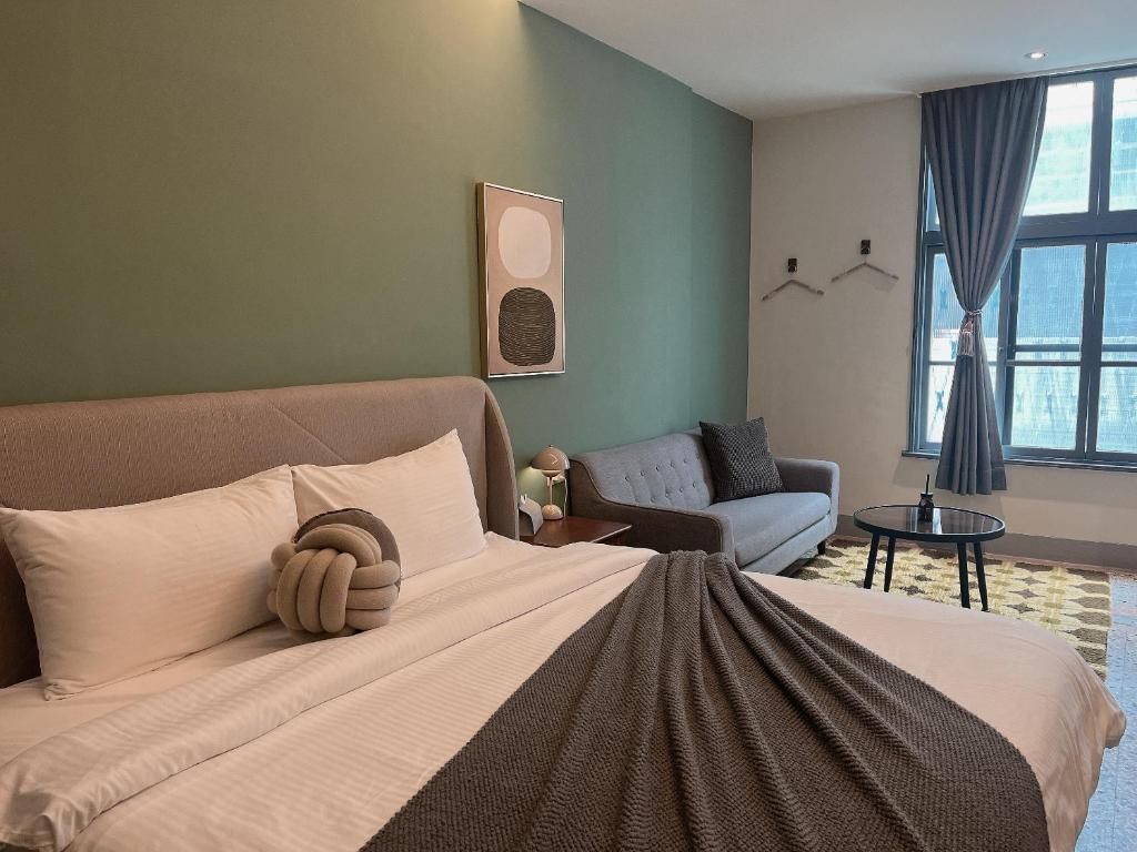 Postel nebo postele na pokoji v ubytování Minilove Homestay