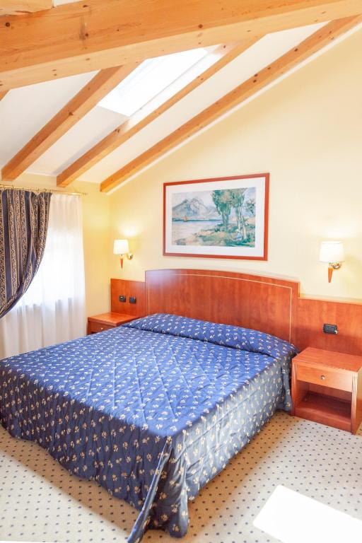 Postel nebo postele na pokoji v ubytování Hotel Olivo