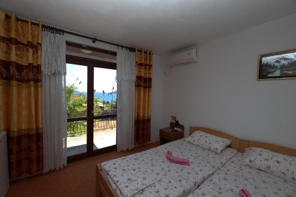 Postel nebo postele na pokoji v ubytování Maja Apartman