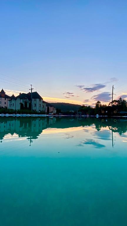 a large body of water with houses in the background at Moonglade Allure Houses in Polyana