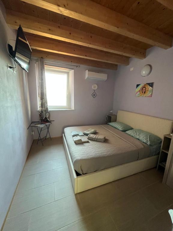 Postel nebo postele na pokoji v ubytování La Stanzetta Viola