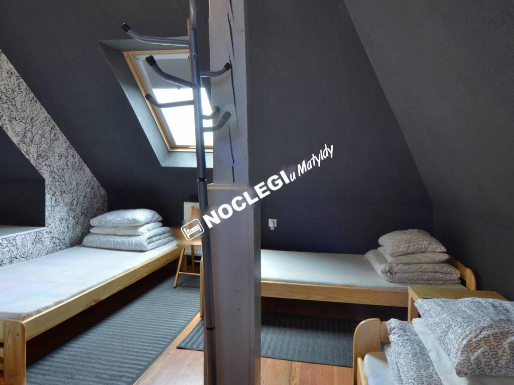 Postel nebo postele na pokoji v ubytování Noclegi u Matyldy