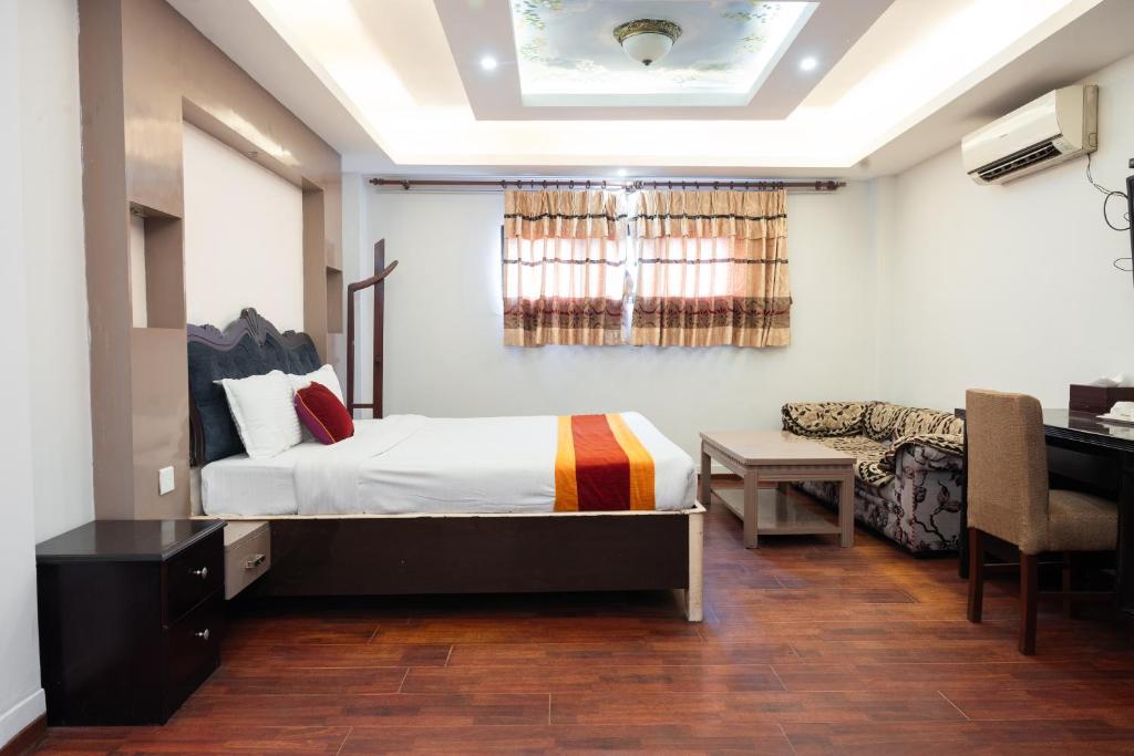 Postel nebo postele na pokoji v ubytování Hotel Kathmandu square
