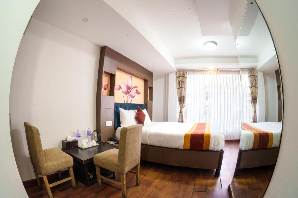 Postel nebo postele na pokoji v ubytování Hotel Kathmandu square