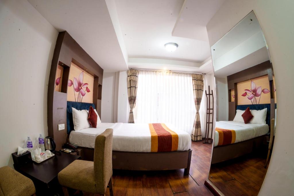 Postel nebo postele na pokoji v ubytování Hotel Kathmandu square