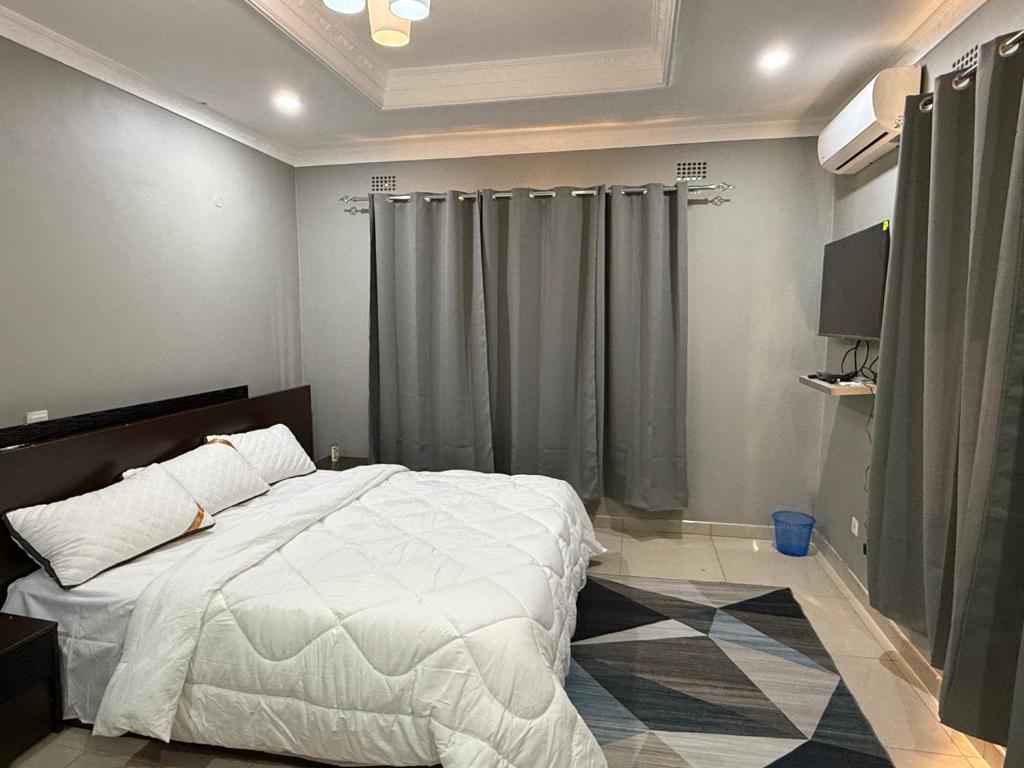 Postel nebo postele na pokoji v ubytování IBEX Hill Apartments and Lodges