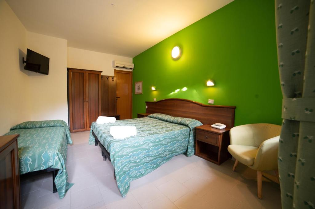 Postel nebo postele na pokoji v ubytování Hotel Villa A Mare