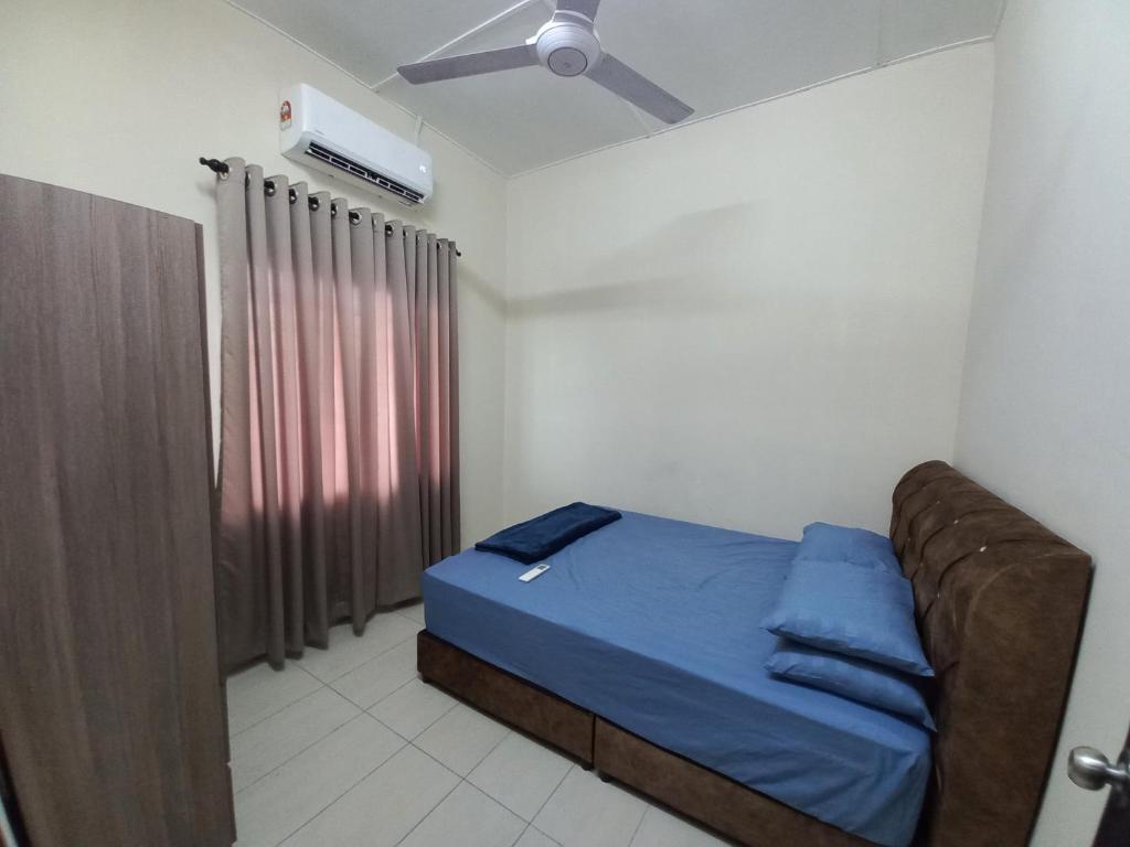 Ένα ή περισσότερα κρεβάτια σε δωμάτιο στο DC Garden Homestay - wifi, netflix