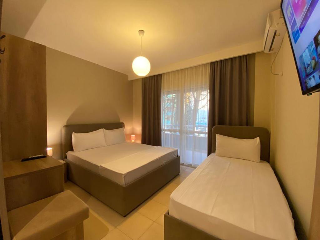 Postel nebo postele na pokoji v ubytování Rumar Hotel