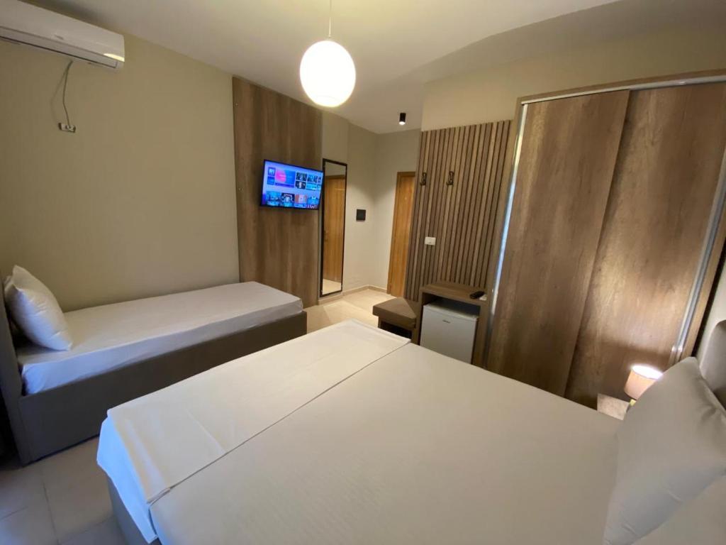 Postel nebo postele na pokoji v ubytování Rumar Hotel