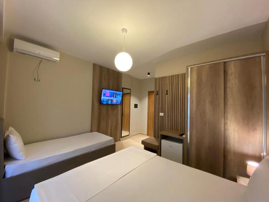 Postel nebo postele na pokoji v ubytování Rumar Hotel