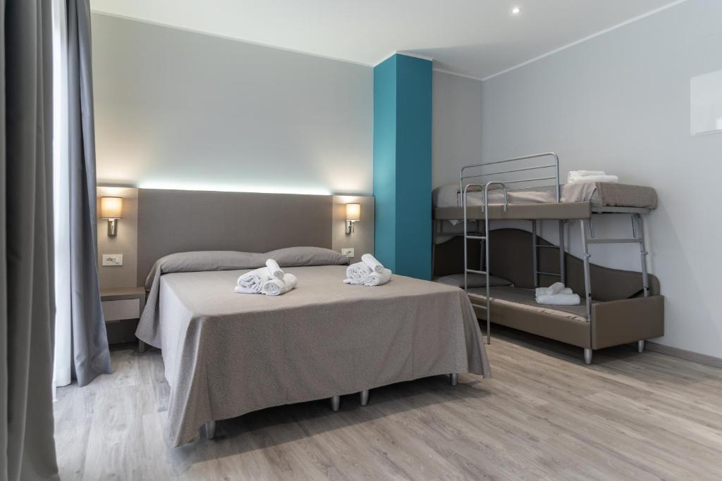 Postel nebo postele na pokoji v ubytování Hotel Cristina
