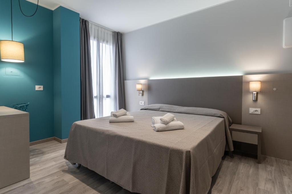 Postel nebo postele na pokoji v ubytování Hotel Cristina