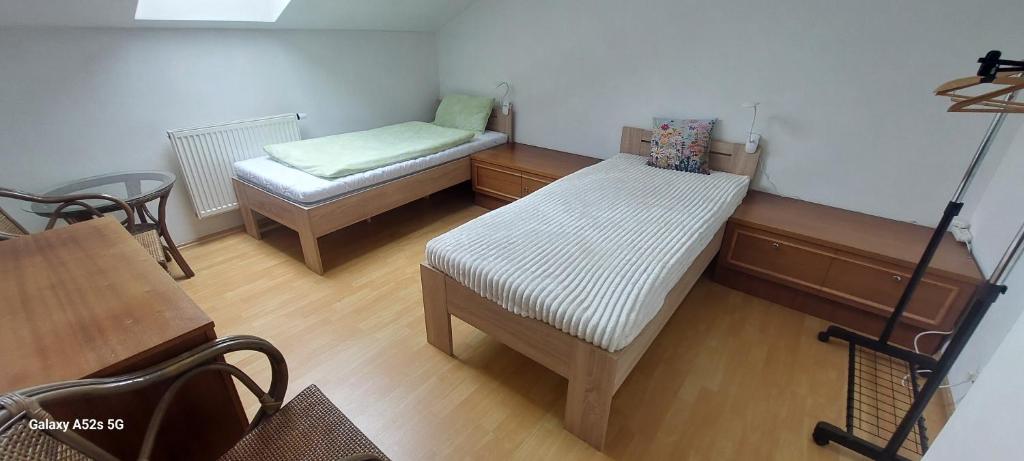 Postel nebo postele na pokoji v ubytování Apartmán 69