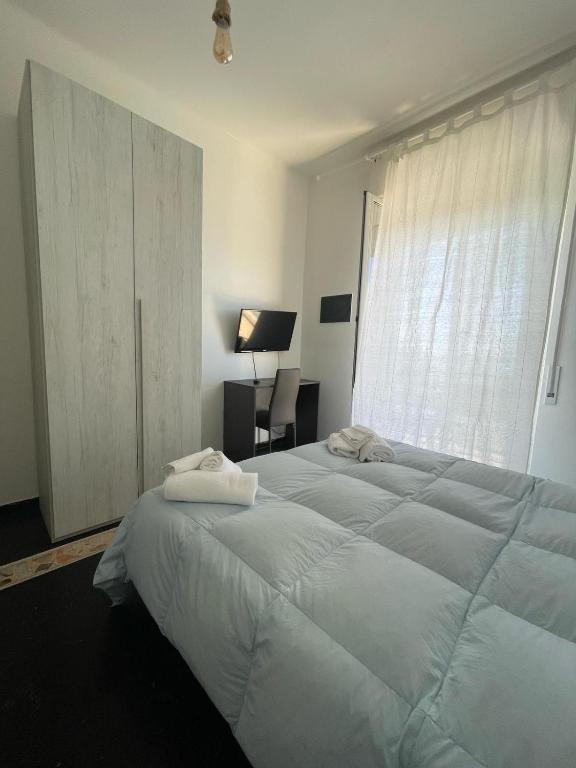 Postel nebo postele na pokoji v ubytování Piccolo Hotel di Lavagna