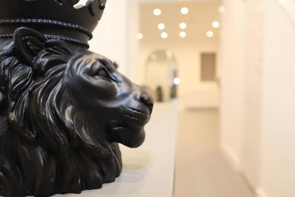 a statue of a lion on display in a museum at 5BDR Spacious En-suite Accomodation in Coventry