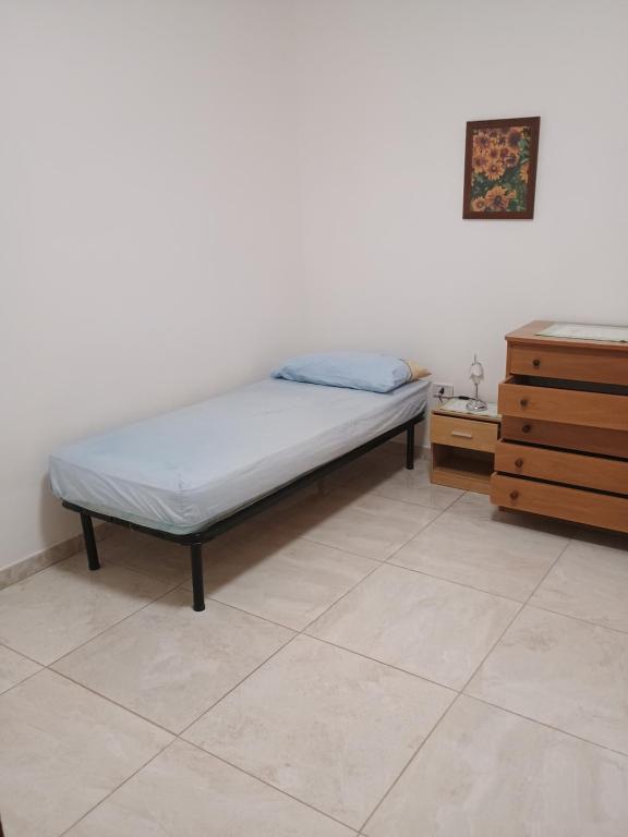 Łóżko lub łóżka w pokoju w obiekcie CASA DEL VINCE