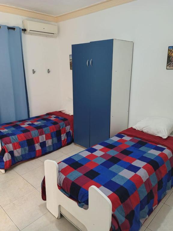 Postel nebo postele na pokoji v ubytování las flores hostal