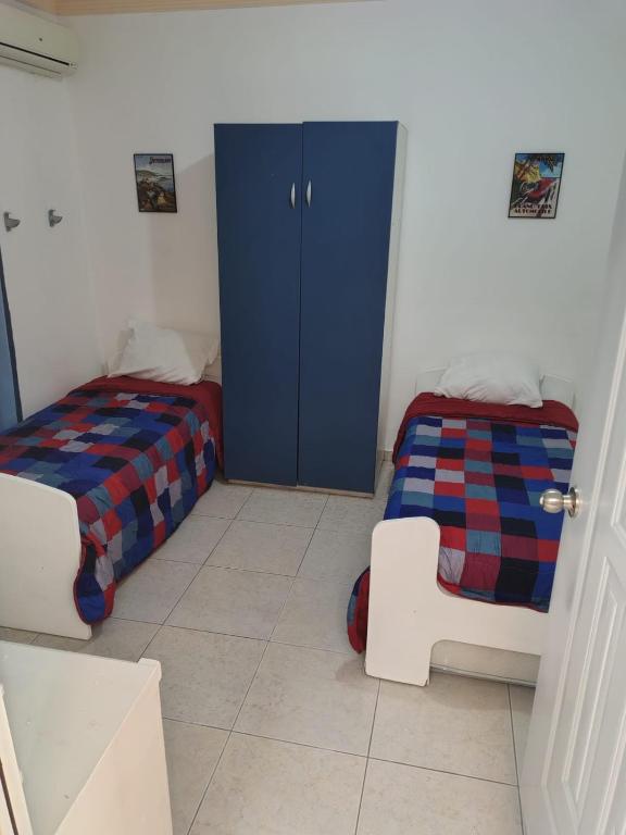 Postel nebo postele na pokoji v ubytování las flores hostal