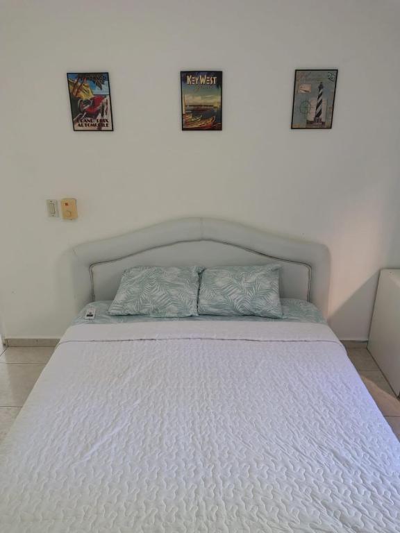 Postel nebo postele na pokoji v ubytování las flores hostal