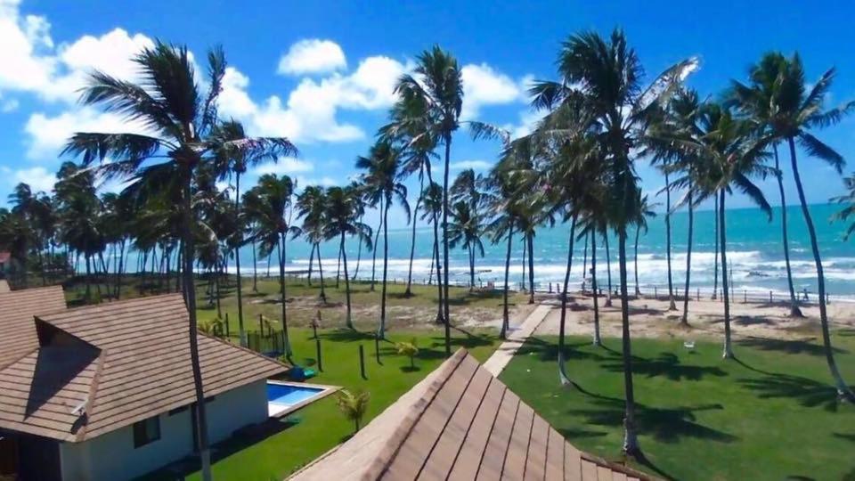 an aerial view of a house and the beach at Carneiros Beach Resort Flat in Tamandaré