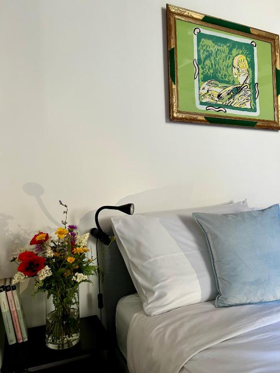 Postel nebo postele na pokoji v ubytování Palazzo Palloni Boutique Apartment