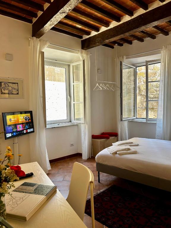 Postel nebo postele na pokoji v ubytování Palazzo Palloni Boutique Apartment