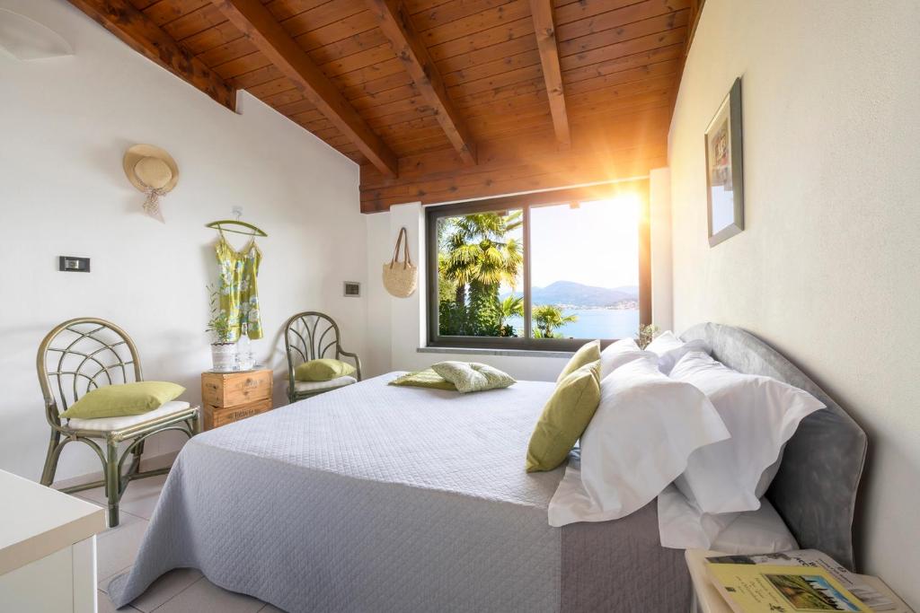 Postel nebo postele na pokoji v ubytování Hotel La Rondinella