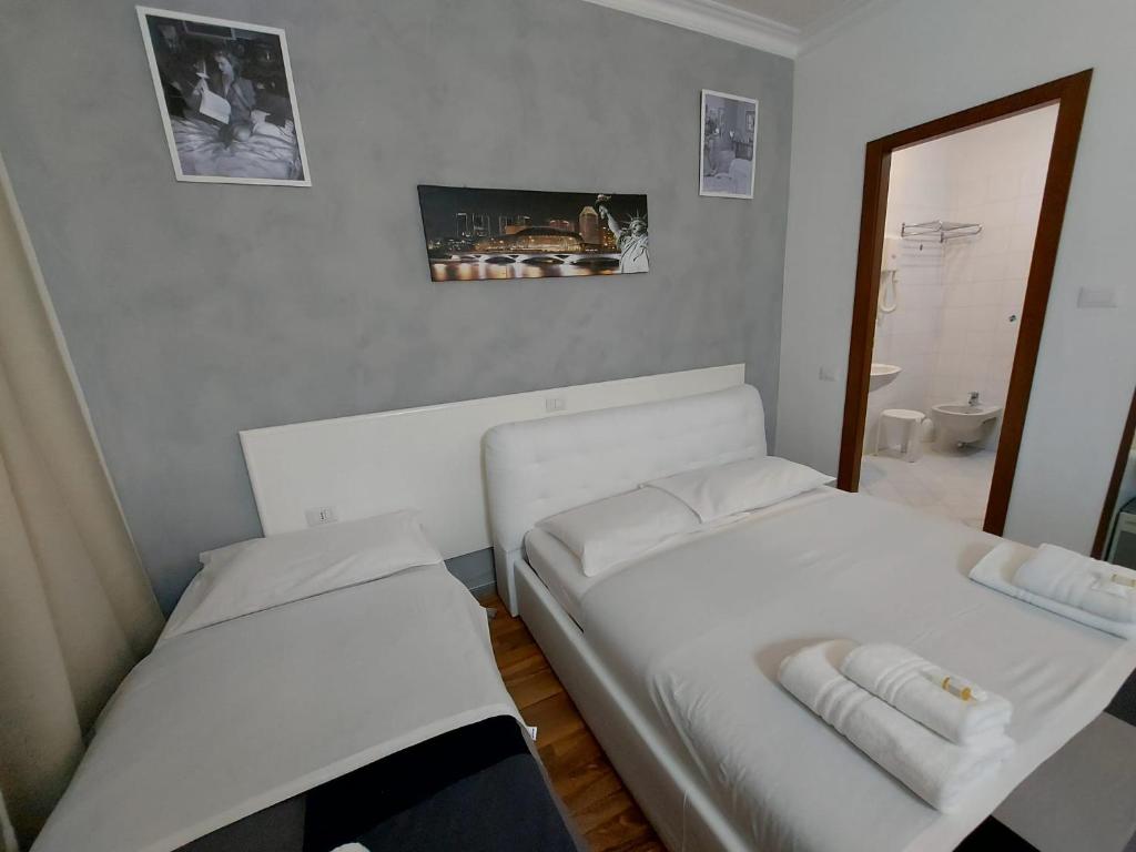 Postel nebo postele na pokoji v ubytování Hotel Positano 2 MIMOSA