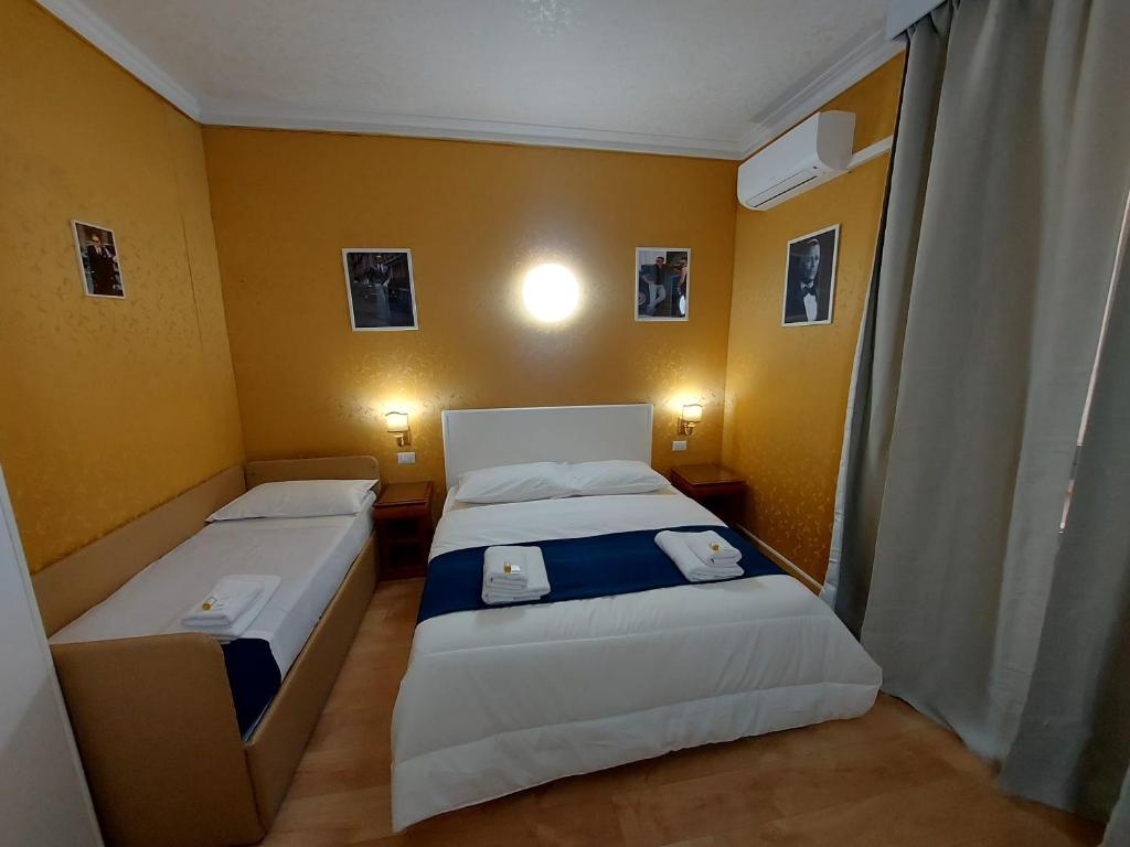 Postel nebo postele na pokoji v ubytování Hotel Positano 2 MIMOSA
