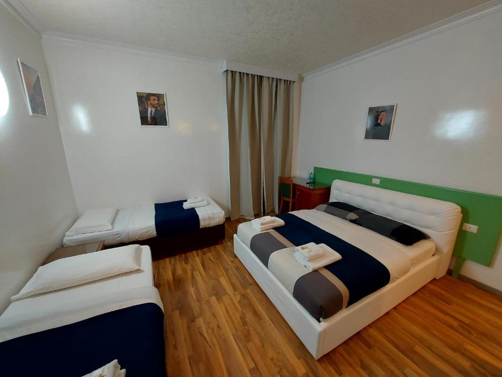 Postel nebo postele na pokoji v ubytování Hotel Positano 2 MIMOSA