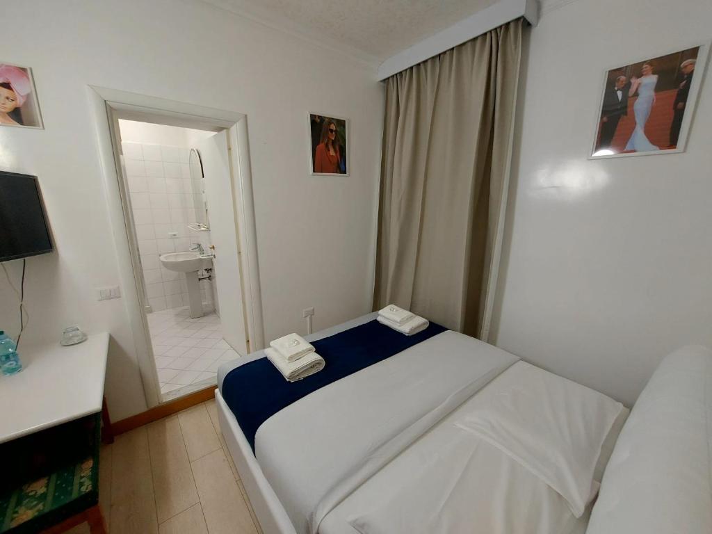 Postel nebo postele na pokoji v ubytování Hotel Positano 2 MIMOSA