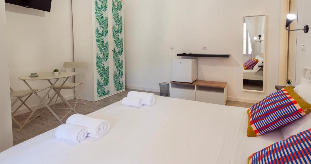 Postel nebo postele na pokoji v ubytování Le Pigne - Mare e Relax