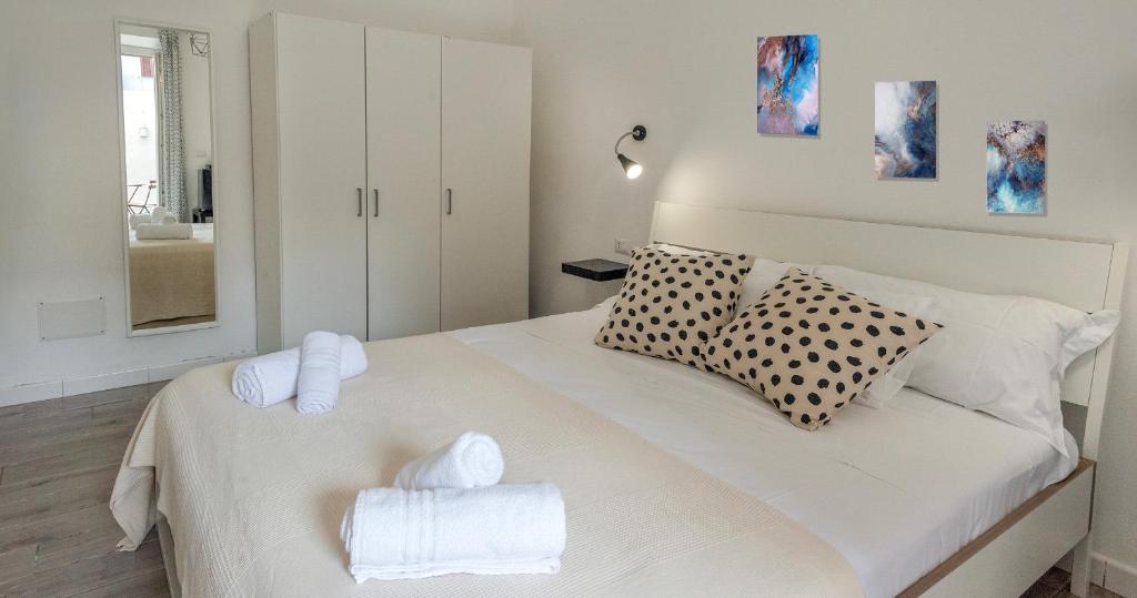 Postel nebo postele na pokoji v ubytování Le Pigne - Mare e Relax