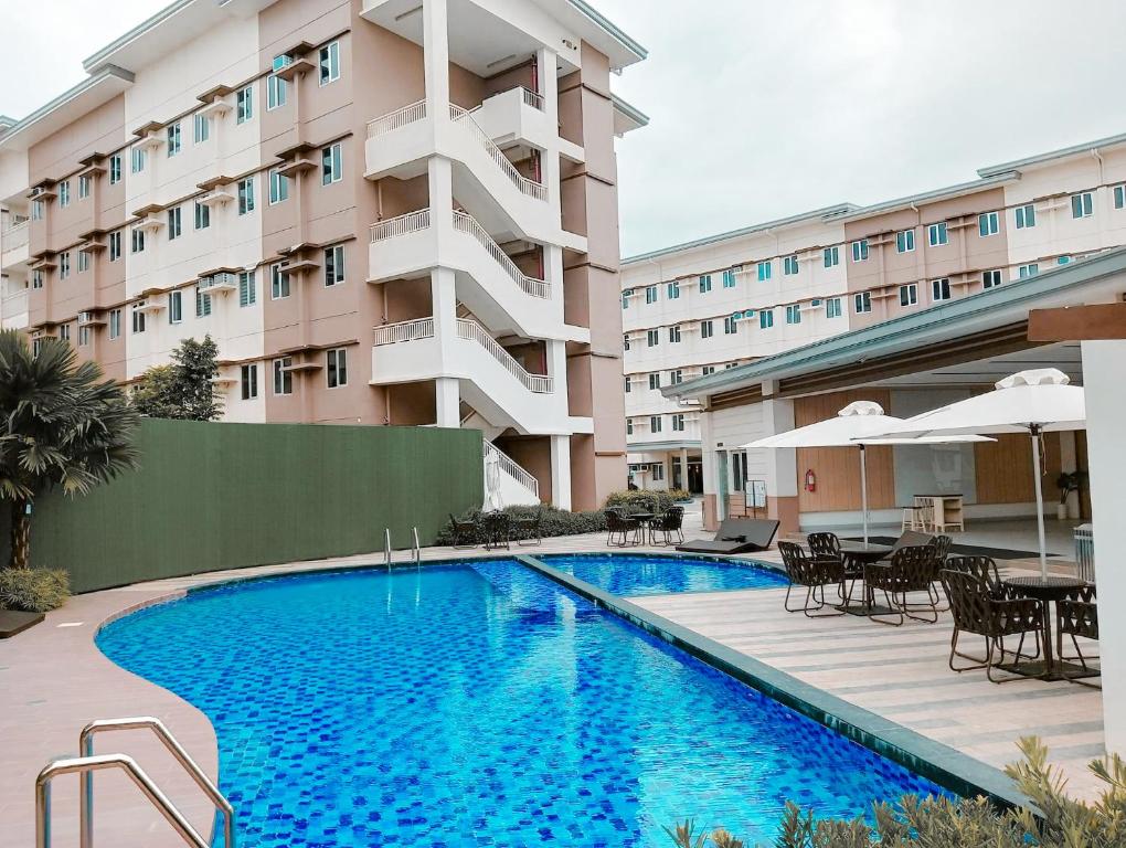 Bazén v ubytování SMDC Cheer Residences Beside SM Marilao with PS4 nebo v jeho okolí