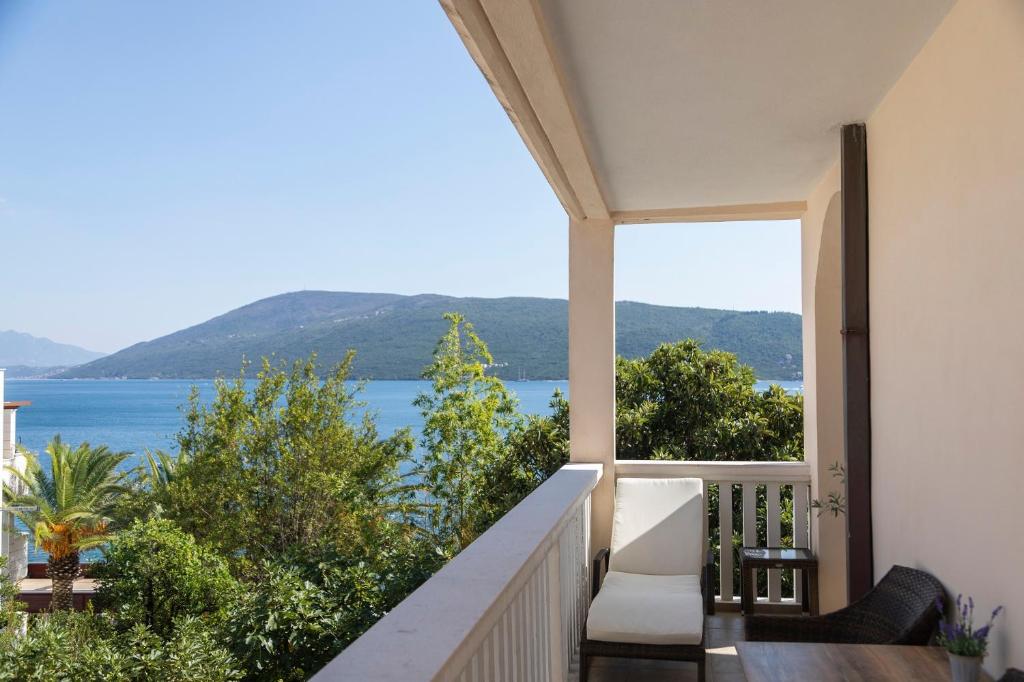 a balcony with a view of the water at Vila Midami - Herceg Novi Savina in Herceg-Novi