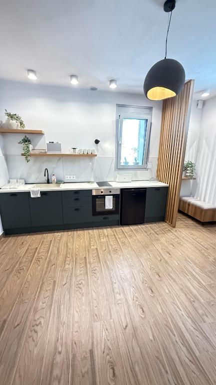 Kuchyň nebo kuchyňský kout v ubytování EllinFos Apartments
