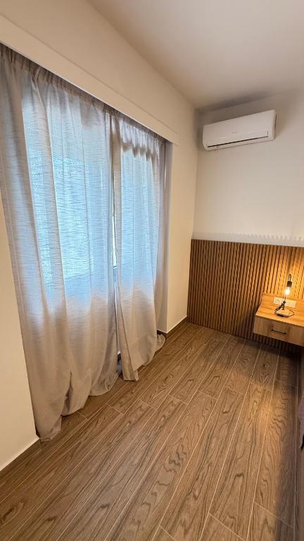 Postel nebo postele na pokoji v ubytování EllinFos Apartments