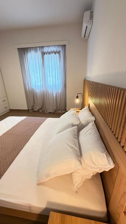 Postel nebo postele na pokoji v ubytování EllinFos Apartments