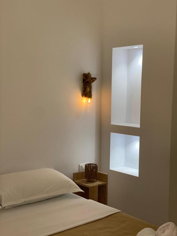 Postel nebo postele na pokoji v ubytování Hotel Vellezrit Guri