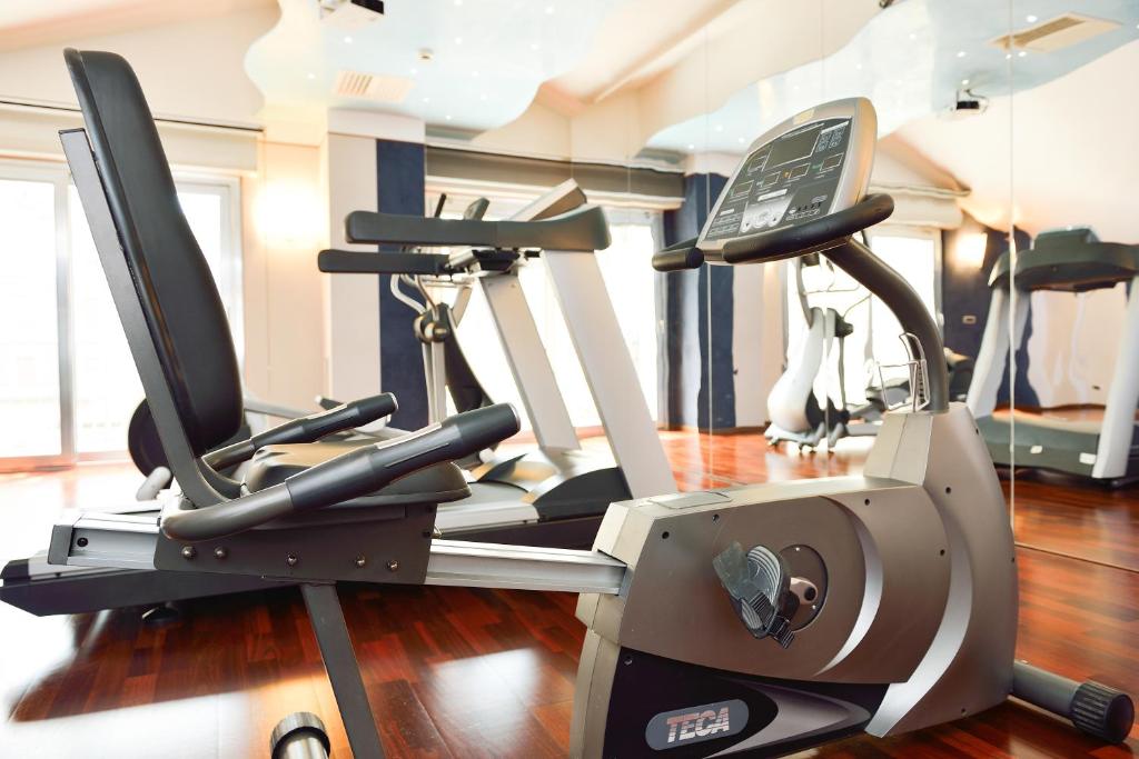 a gym with two exercise bikes in a room at Victoria Hotel in Pescara