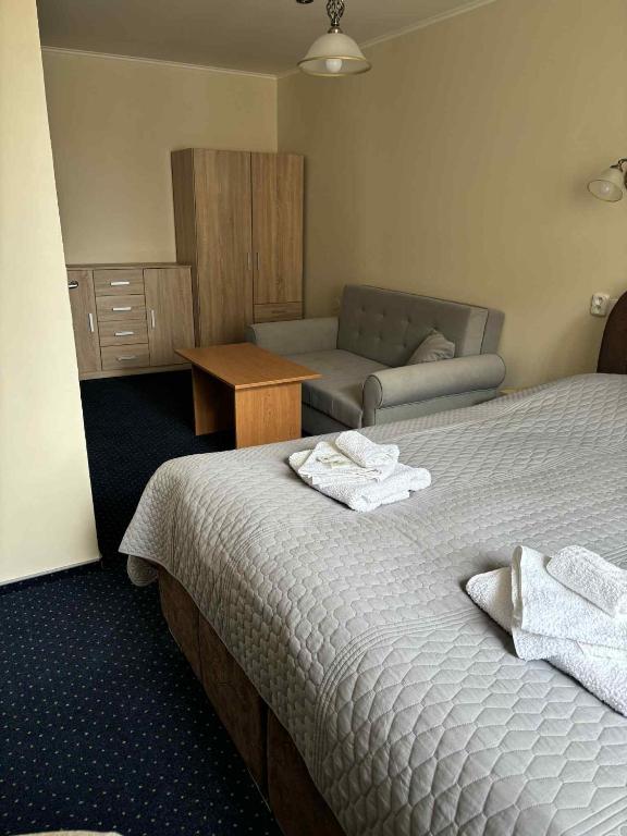 Postel nebo postele na pokoji v ubytování Hotel Alster