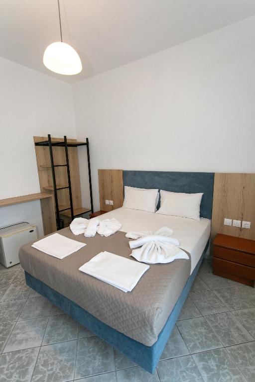 Postel nebo postele na pokoji v ubytování Hotel Agios Athanasios
