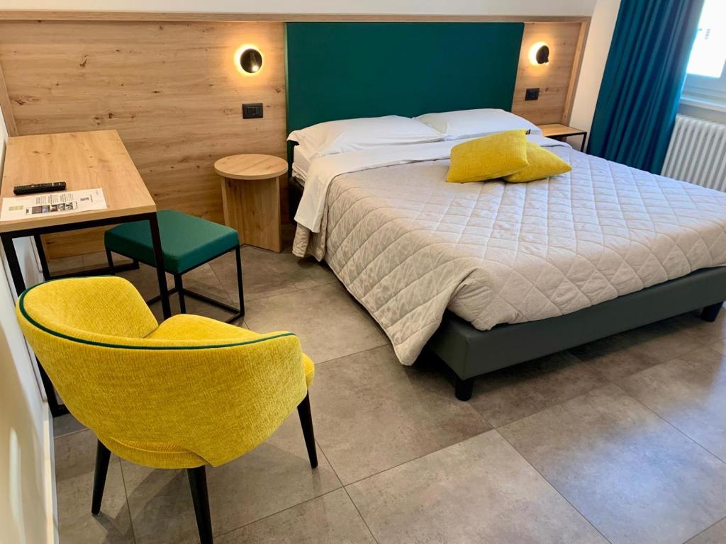 Postel nebo postele na pokoji v ubytování Hotel Locanda Alla Perla