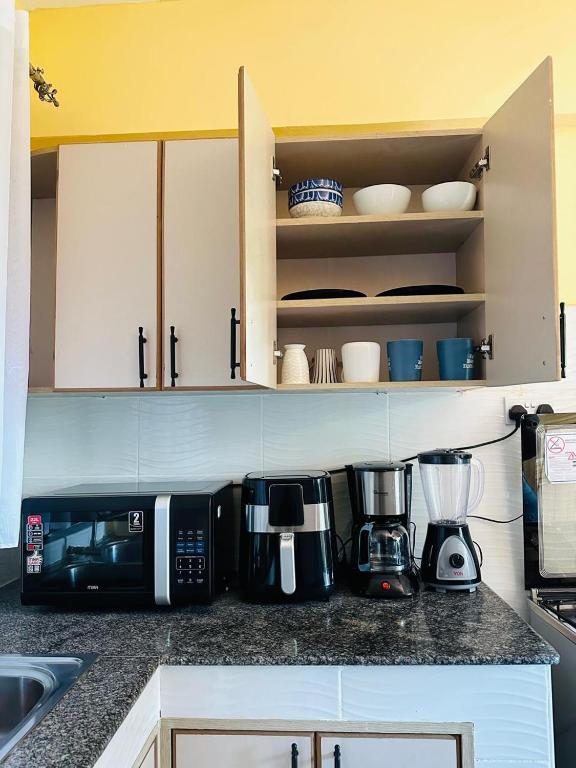 Kuchyň nebo kuchyňský kout v ubytování Rupa view Suites