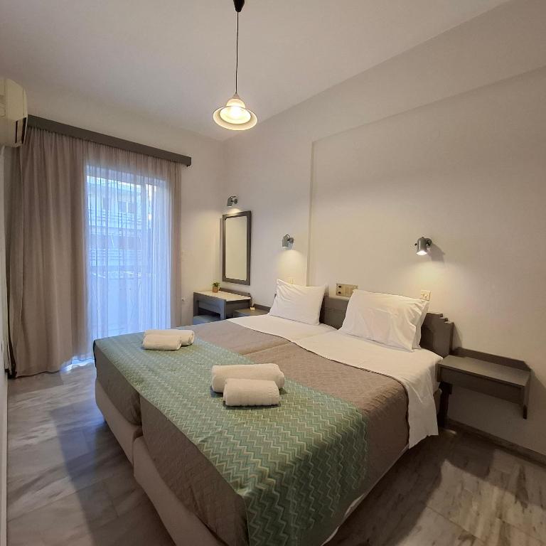 Postel nebo postele na pokoji v ubytování Mardinik Hotel Apartments