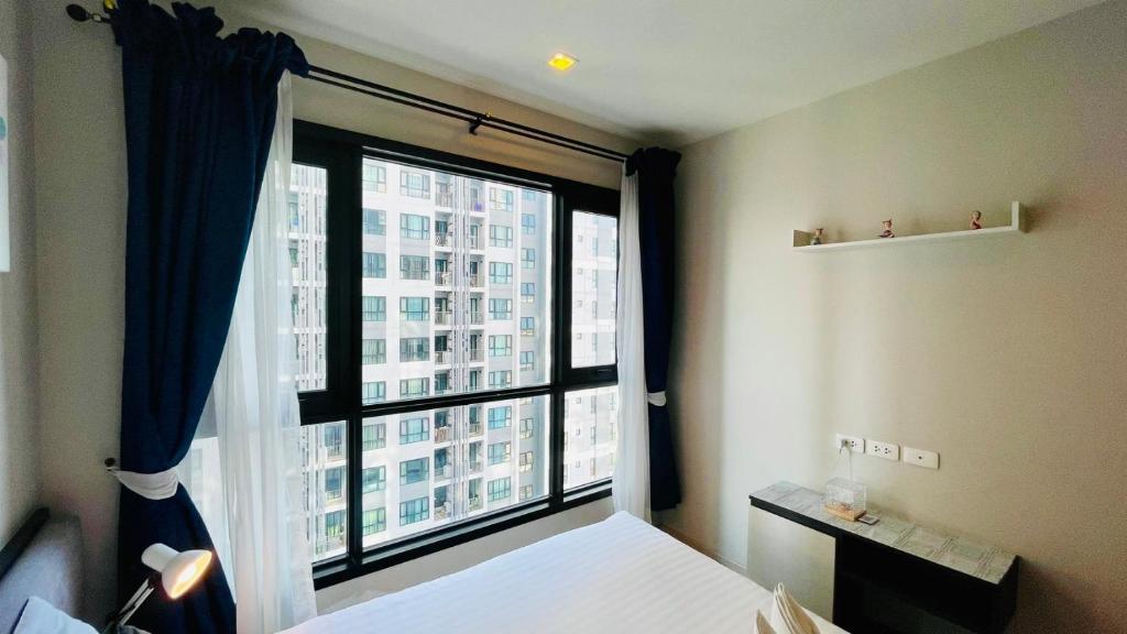 Кровать или кровати в номере The base Central Pattaya 975 by Numam
