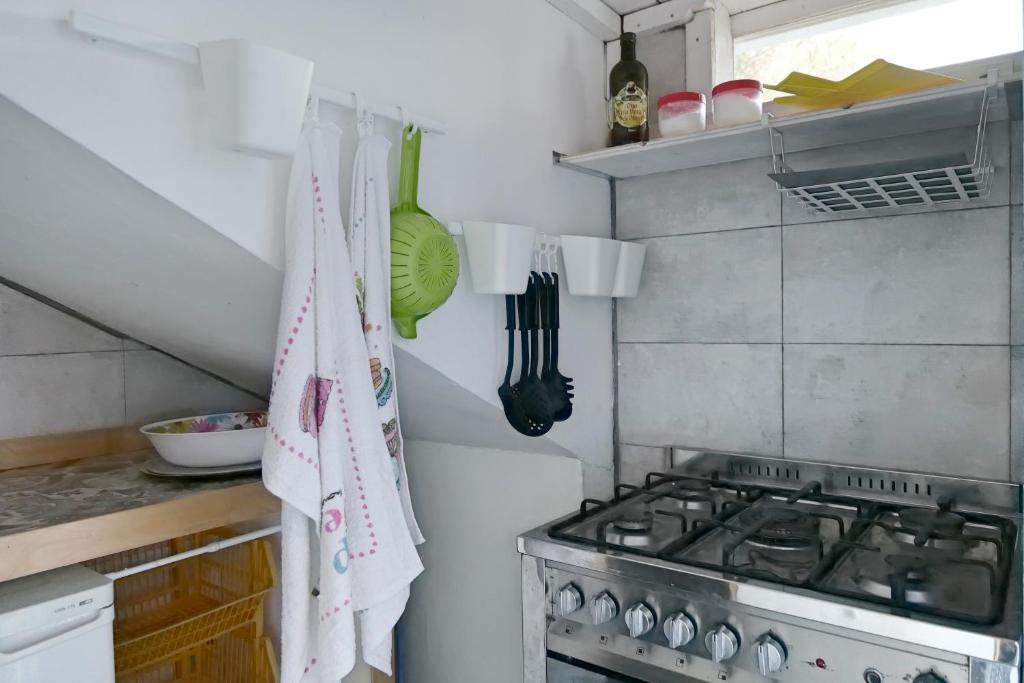 A kitchen or kitchenette at Depandance in Villa Gisella