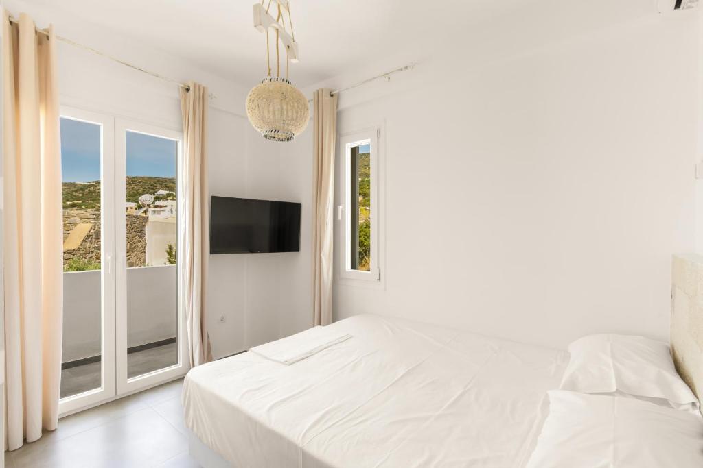 Postel nebo postele na pokoji v ubytování White Villas Paros