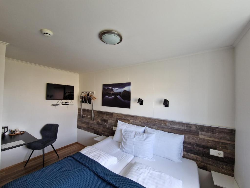 Postel nebo postele na pokoji v ubytování Guesthouse Mikael